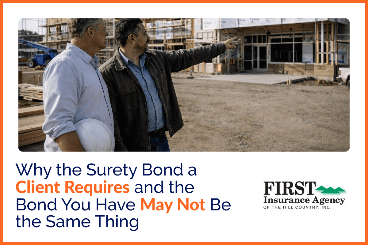 A general contractor and subcontractor reviewing a completed commercial building project together on site in natural daylight.